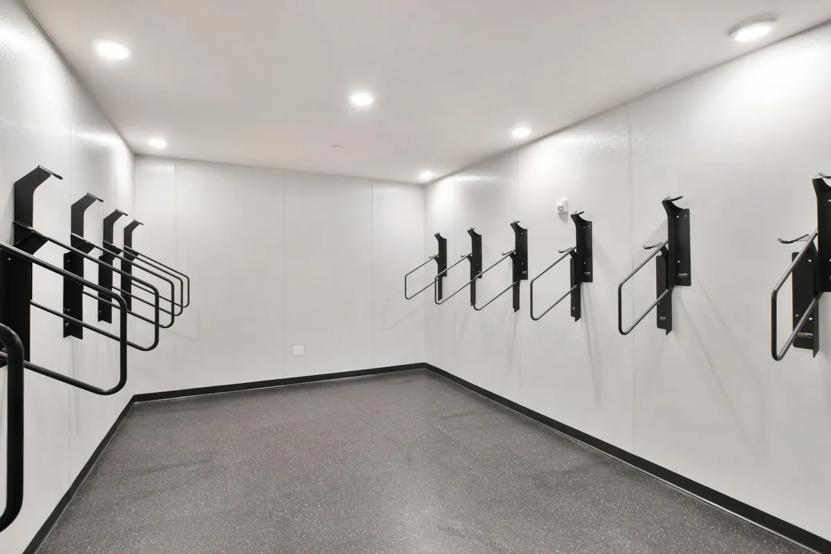 A bike storage area with racks, suggesting easy access for cycling adventures. The minimalistic space is functional and hints at an active, outdoor lifestyle, perfect for guests who want to take advantage of the local mountain biking trails.